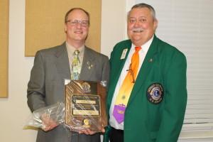 Lion John Lynde receives Melvin Jones and Bulletin award from DG Ron Beltran