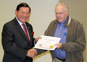 Past International Director Sid Scruggs presents Lion Tom Carter with anInternational President's Certificate of Appreciation
