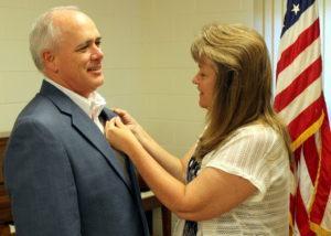 Lion Tony Gravanda receives the President pin from wife Lion Debbie Gravanda