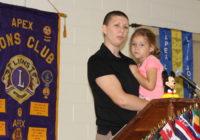 Amanda Lunn holds Amber while speaking at the Apex Lions Club