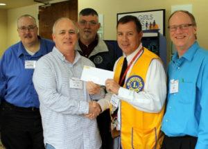 Apex Lions present the Boys & Girls Home with a check at the Mid-Winter Convention. Back row (l to r): PDG Lion Wayne Faber, Lion Garry Elliott, Front row: President Lion Tony Gravanda hands check to Lion Gary Greene, Secretary Lion John Lynde