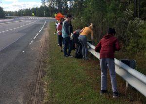 Leo club members picking up trash on McCrimmon Parkway