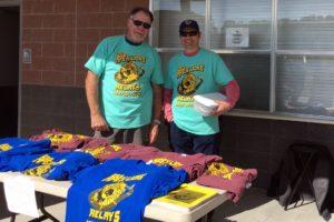 Lion Carl and Lion Rich selling shirts at the 2018 Relays