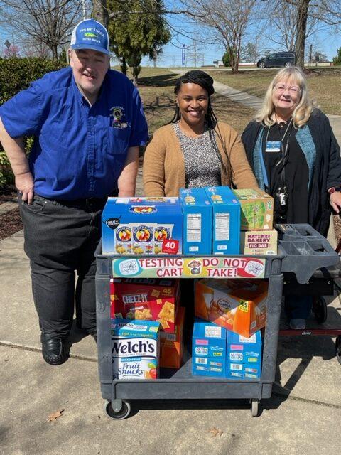 Lions Linda Cromwell and Wayne Faber with School Counselor Candis Lewis at Olive Chapel Elementary