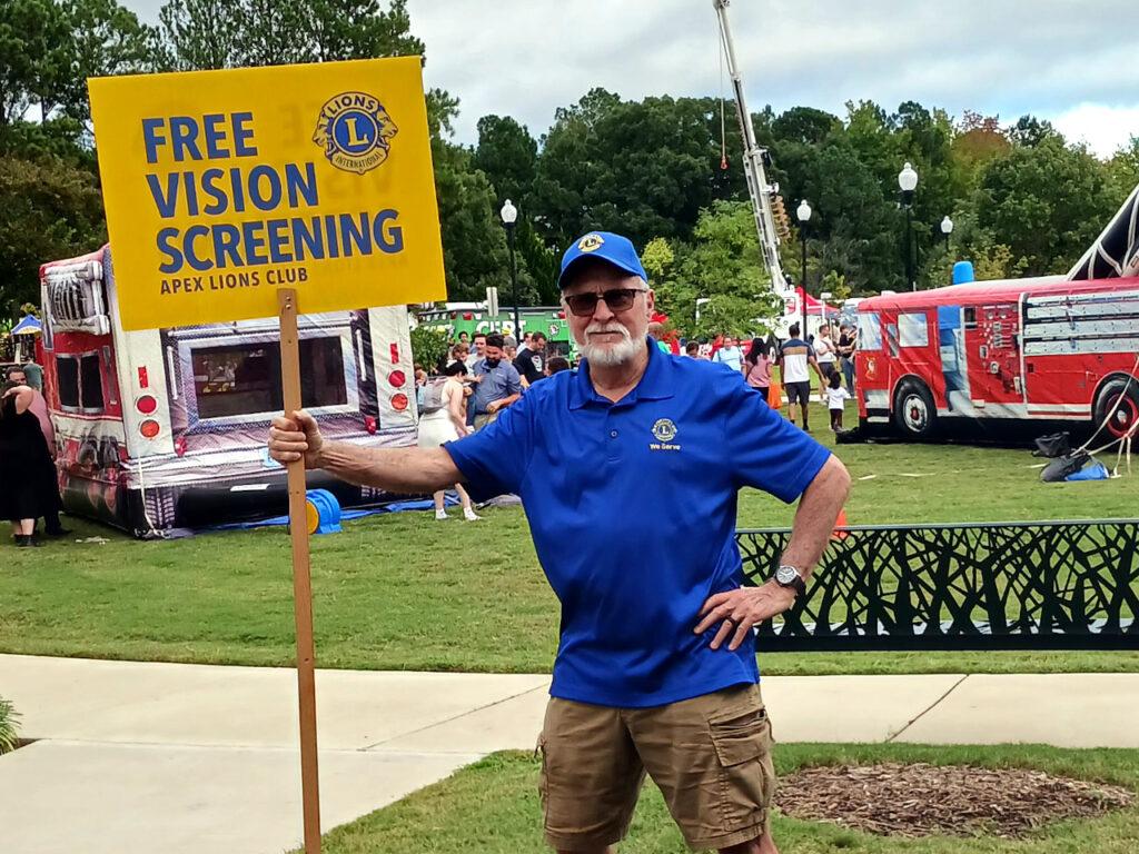 Lion Paul advertising free vision screenings!