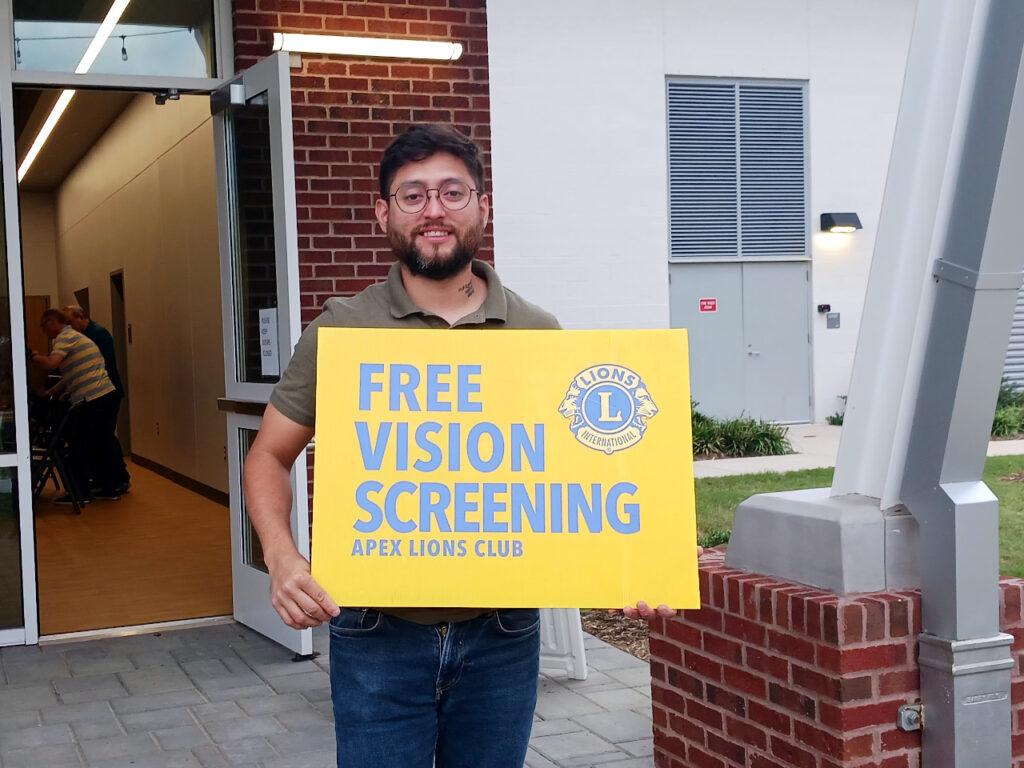 Lion Josue advertising free vision screenings!