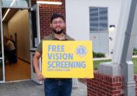 Lion Josue advertising free vision screenings!